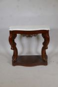 A C19th mahogany serpentine front console table, with marble top raised on shaped and pierced scroll