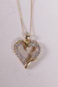 A 14ct yellow gold heart shaped pendant necklace, set with diamonds