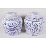 A pair of Oriental blue and white porcelain ginger jars and covers, 8" high
