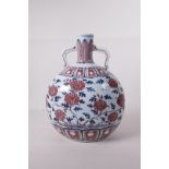A Chinese blue, white and red porcelain two handled moon flask with floral decoration, 11" high