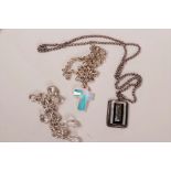 A silver chain and crystal crucifix pendant, a silver bracelet set with crystals and a silver