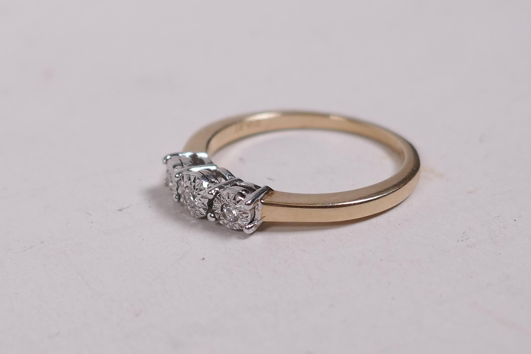 A 9ct gold ring set with three diamonds, 0.7ct, size O - Image 2 of 3
