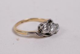 An 18ct yellow gold and platinum ring, set with three diamonds, approx 0.3ct, 3.1g, size J