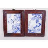 A pair of Chinese blue and white porcelain panels decorated with a chicken and bird, mounted in