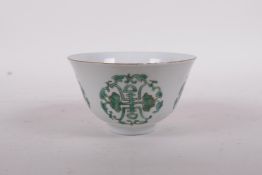 An early C20th Chinese porcelain tea bowl decorated with green enamel longevity symbol, Daoguang
