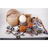 A collection of African artefacts including an ostrich egg, pottery bowls, gourds, bead jewellery