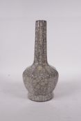 A Chinese celadon crackle glazed pottery vase with fluted neck, 9" high