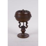 A Chinese bronze ball censer, the cover with pierced dragon decoration, 6" high
