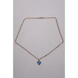 A 9ct gold chain, 18" approx 4g with heart shaped pendant set with blue topaz