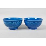 A pair of blue glazed porcelain rice bowls of lotus flower form, Chinese Qianlong seal mark to base,