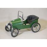 A vintage 'Great Gizmos Ltd' child's classic pedal car in racing green