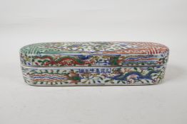 A wucai porcelain scribes box with dragon and phoenix decoration, six character mark to side,