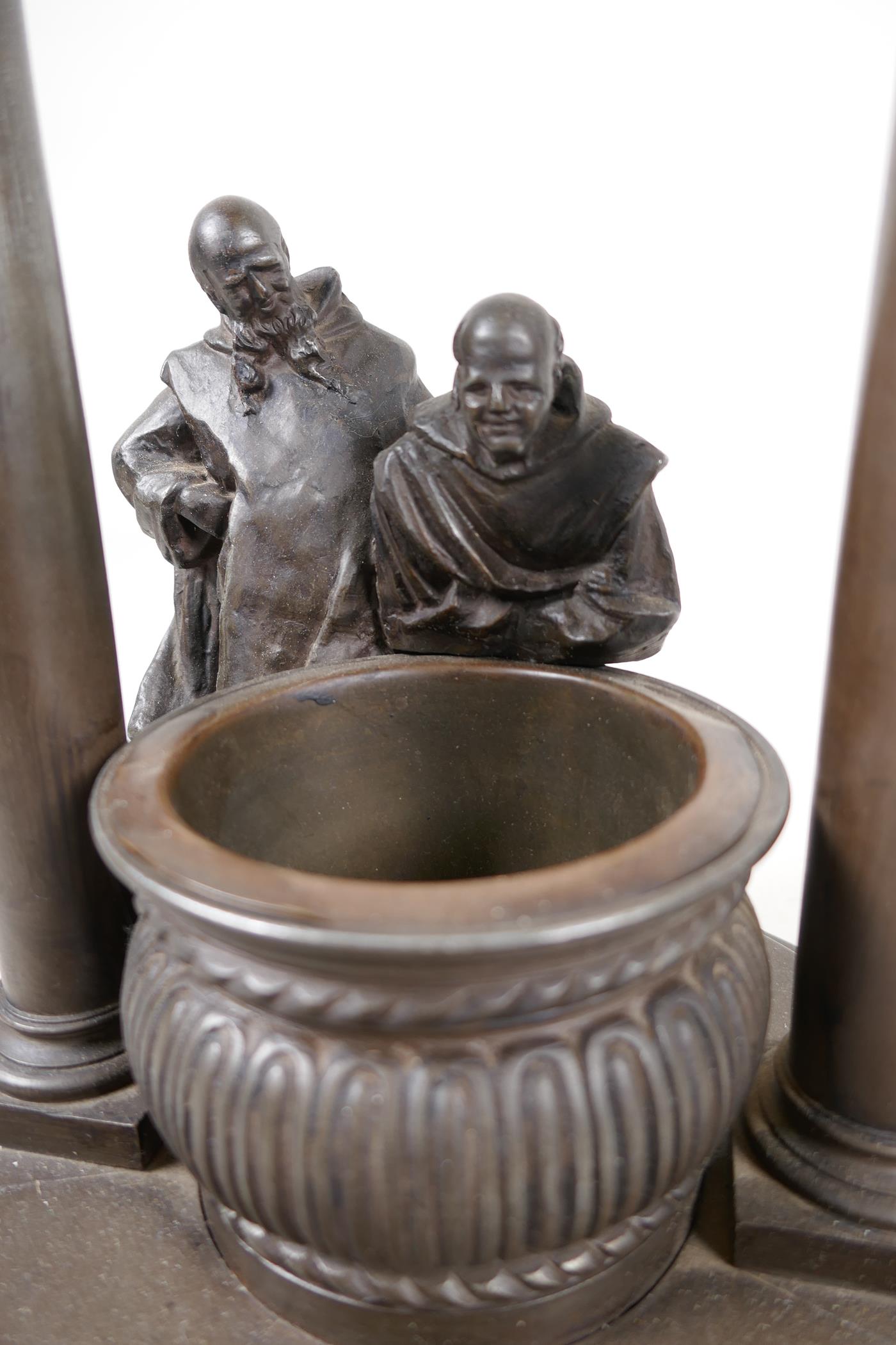 A bronze stand cast as two classical figures looking into a well, 10" diameter, 11" high - Image 2 of 6