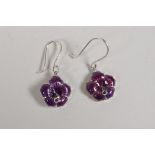 A pair of 925 silver and purple enamel flower head earrings