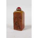 A Chinese soapstone seal/snuff bottle with carved decoration of a river landscape, 3" high