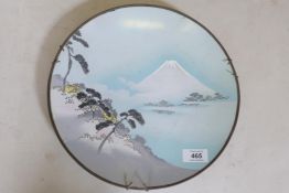 A Japanese cloisonne enamel charger with a view of Mt Fuji, late Meiji, 12" diameter, chipped