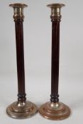 A pair of ribbed column wood and plated metal candlesticks, 16" high