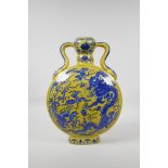 A Chinese yellow ground porcelain two handled moon flask with blue and white dragon and phoenix