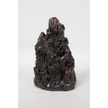 A Chinese faux horn carving of a mountain landscape with figures, carved character mark to base, 7½"