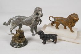 A bronze figure of a gundog with retrieved bird, 8" long, a bronze figure of a spaniel, a bronzed