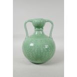 A Chinese green glazed porcelain garlic head vase, with underglaze lotus flower decoration, seal