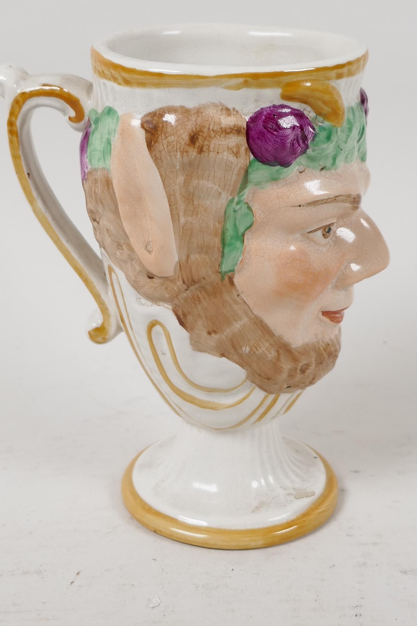 A Fayence Bacchus face mug with surprise frog inside, 5" high