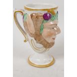 A Fayence Bacchus face mug with surprise frog inside, 5" high