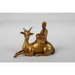 A Chinese gilt bronze of Shao Lao riding a deer, 5" long, 4" high