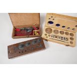 Two sets of chemist weights, (one incomplete) and a set of gold scales, A/F