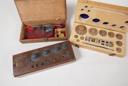 Two sets of chemist weights, (one incomplete) and a set of gold scales, A/F