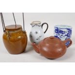 A Chinese Yixing redware teapot, 7" long, an early sparrow beak jug, an oriental storage jar and