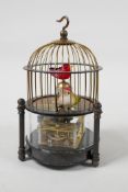 A brass automaton birdcage clock, 6½" high
