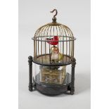 A brass automaton birdcage clock, 6½" high