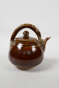 A Chinese treacle glazed teapot, 5" high