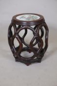 A Chinese carved hardwood bamboo lattice style jardiniere stand, the top inset with a polychrome