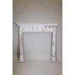 A Victorian painted pine fire surround with fluted columns and applied carved wood clamshell and