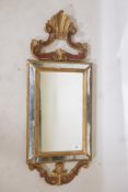 A Venetian painted and giltwood cushion shaped wall mirror, early C20th, 35" x 14"