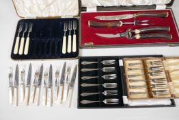 A George Butler stag horn handled carving set, boxed, together with two boxed sets of cake forks,