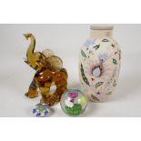 A C19th milk glass vase painted with flowers, 9" high, a Murano glass figure of an elephant and