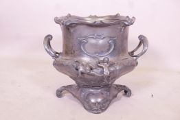 An antique white metal two handled ice bucket, 14" high
