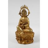 A Chinese filled gilt bronze Quan Yin seated on a lotus throne, 12" high, A/F repair