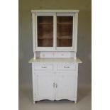 A Continental painted dresser, with glazed upper section on a base of two drawers over two