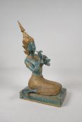 A Thai bronze figure of a female court musician, with gilt details, 15" high