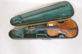 An antique violin and bow in case, bears label Andreas Amati fecit, Cremonae anno 1604, back 14½"