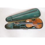 An antique violin and bow in case, bears label Andreas Amati fecit, Cremonae anno 1604, back 14½"