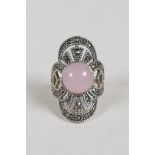 An Art Deco style 925 silver dress ring with a central set rose quartz and marcasite, size N/O