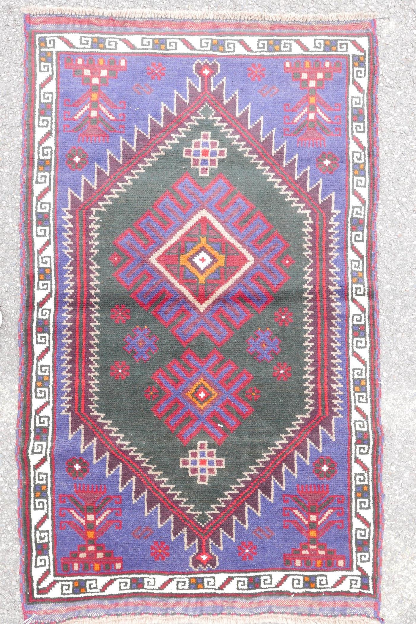 A multi colour ground full pile Belouch nomadic rug with unique medallion design, 36" x 60" - Image 2 of 4