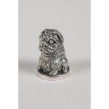 A sterling silver thimble in the form of a pug dog, 1" high