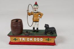 A cast iron 'Trick Dog' money box, 8" long, A/F