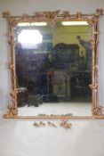 A C19th giltwood and composition overmantel mirror of naturalistic form, A/F, 52" x 59"